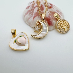 18k gold plated shell charms with heart, moon, and tree of life motifs for DIY jewelry