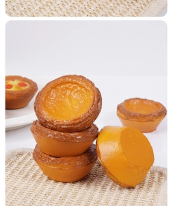 Detailed macro view showing realistic flaky crust texture of simulated egg tart models