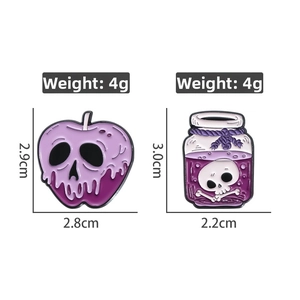 Detail of Halloween skull apple and potion bottle enamel pins with size and weight specs