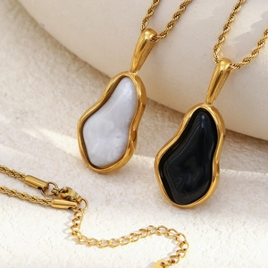18K gold plated stainless steel necklace with fluid pendants in marble and black stone