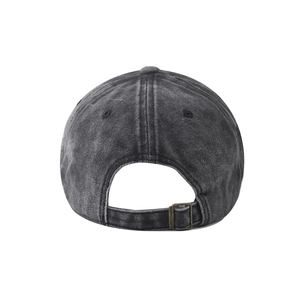 Detail view of the washed cotton baseball cap featuring an adjustable metal buckle strap