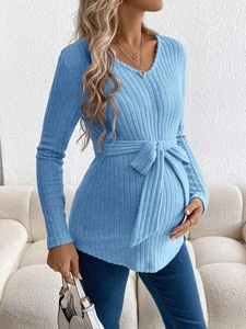 Blue V-neck long sleeve maternity knit top with adjustable waist tie and ribbed texture
