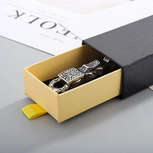 Detail of vintage silver bracelet with embossed patterns in a drawer jewelry gift box