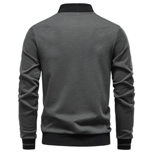Detailed back view of a dark grey men's jacket with black knit ribbed hem and cuffs