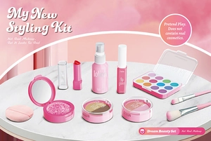 Flat lay of pretend play makeup set with fake lipstick and eye shadow for girls