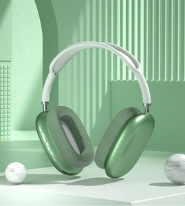 Detail of green wireless over-ear headphones featuring mesh cushions and side controls
