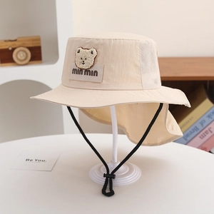 Detail of kids sun hat with neck flap, breathable mesh, and cute bear patch decoration