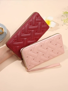 Quilted long wallets for women with heart pattern and wrist strap in burgundy and pink