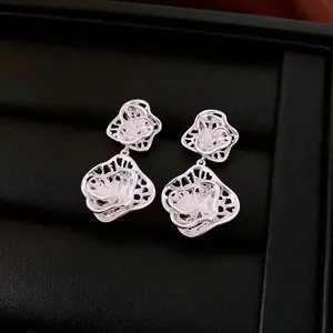 Elegant silver-tone double-layered hollow flower drop earrings with a luxury woven design