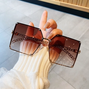 Chic oversized square sunglasses with gradient brown lenses and gold chain link temples
