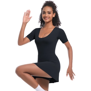 Detail of black athletic tennis dress featuring built-in shorts and a deep U-neckline