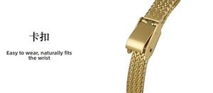 Detail view of golden wheat-pattern watch strap with secure fold-over clasp design