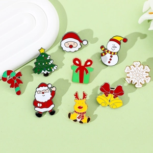 Set of 9 Christmas enamel pins featuring Santa, reindeer and snowman on green background