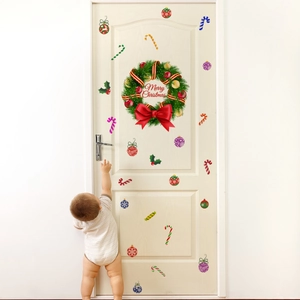 Festive Christmas wreath wall sticker with Merry Christmas text on a white door