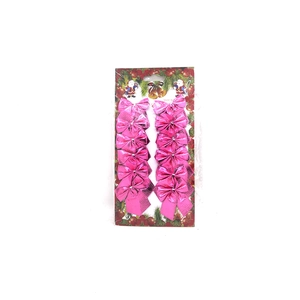 Set of 12 glossy pink Christmas bows on festive card packaging for holiday tree decor