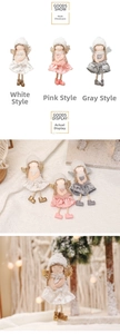 Detail view of plush Christmas angel dolls with lace wings and fuzzy hats in three colors