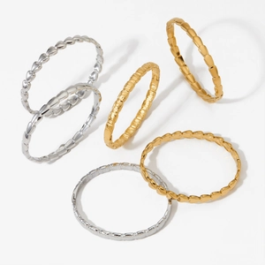 Elegant gold and silver stainless steel bangles with heart and striped patterns