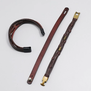 Close-up of handmade leather bracelets for men featuring woven textures and metal clasps