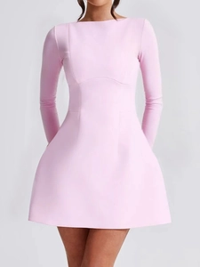 Detail view of pink long sleeve mini dress featuring slim fit waist and A-line skirt