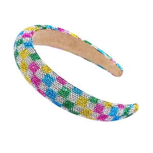 Close-up of a wide headband with colorful rhinestones in a checkerboard pattern