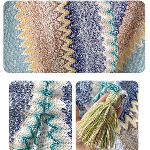 Ethnic knit shawl featuring vibrant wavy patterns and premium tassel details for travel