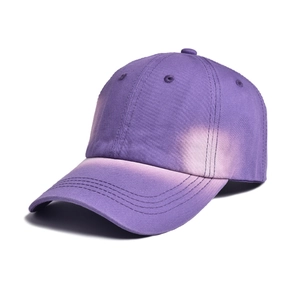 Detailed macro view of the purple tie-dye gradient cotton twill texture and neat stitching