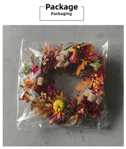 Detailed macro view of an autumn wreath with sunflowers and pinecones in clear packaging