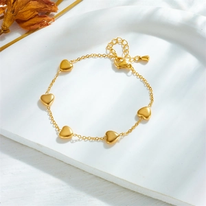 Elegant gold-plated stainless steel chain bracelet featuring five polished heart pendants