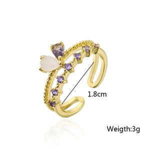 Detail showing 1.8cm diameter and 3g weight of a gold heart ring with purple zircons