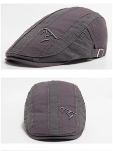 Close-up of vintage camo cotton ivy cap showing A-letter embroidery and metal buckle