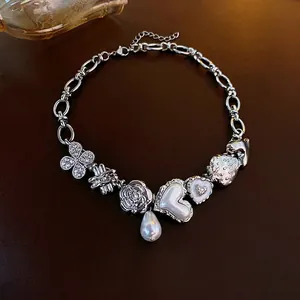 Silver pendant necklace with clover, rose, heart, strawberry and pearl elements