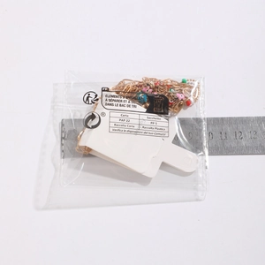 Detailed size measurement of colorful heart pendants on a gold chain with ruler