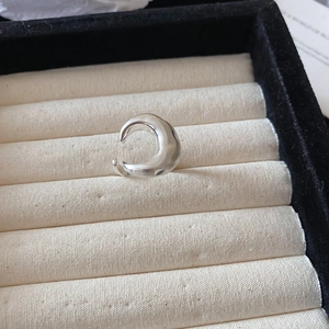 Detailed view of silver wave geometric open ring displayed in a black jewelry gift box
