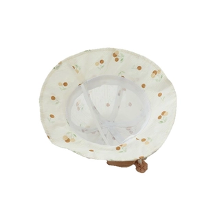 Baby sun hat with cherry print and large bow tie in cream white for spring and summer
