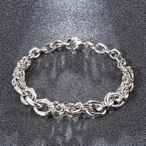 Detailed view of silver titanium steel dragon scale chain bracelet with lobster clasp