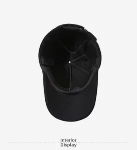 Interior view of black winter baseball cap showing stitched lining and ear protection