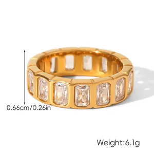 Macro detail of gold eternity ring with rectangular zircons showing 0.66cm width