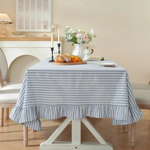 Blue and white striped rectangular tablecloth with elegant ruffled edge for dining decor