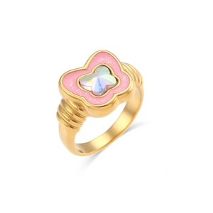 Macro detail of butterfly ring with pink enamel wings and iridescent center stone