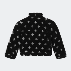 Détail du dos de la veste polaire noire ornée d'imprimés floraux en forme de croix blanche