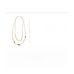 Detail of bohemian layered necklace with colorful glass and ceramic beads on gold chain