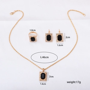 Detailed view of bridal jewelry set dimensions with gold metal and black square stones