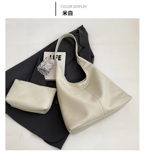 Detail view of large beige lychee texture tote bag and matching inner pouch set