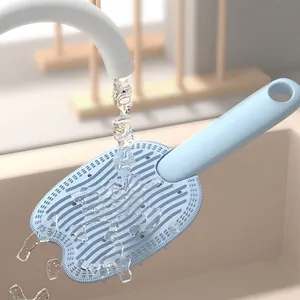 Dual-sided silicone pet massage brush in light blue for cat grooming and skin care