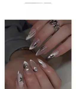 Detailed view of grey-purple cat eye press-on nails with 3D silver metal stars