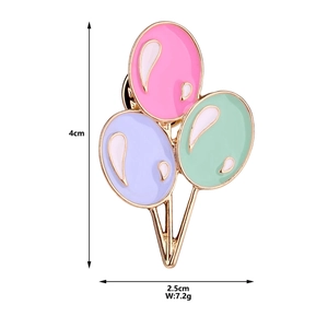 Detail view of cartoon balloon brooch with 4cm height and 2.5cm width dimensions