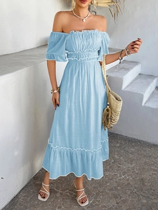 Detail of light blue off-shoulder bohemian dress with ruffled hem and waisted design