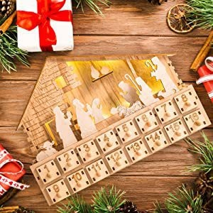 Close-up of wooden advent calendar with LED Nativity scene and numbered drawers