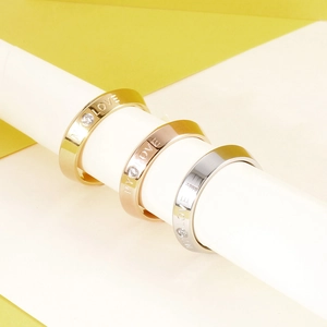 Three My Love engraved titanium steel rings in gold, rose gold, and silver finishes