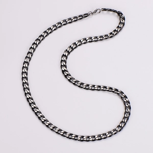 Detail of 7mm stainless steel Cuban link necklace with black and silver matte finish